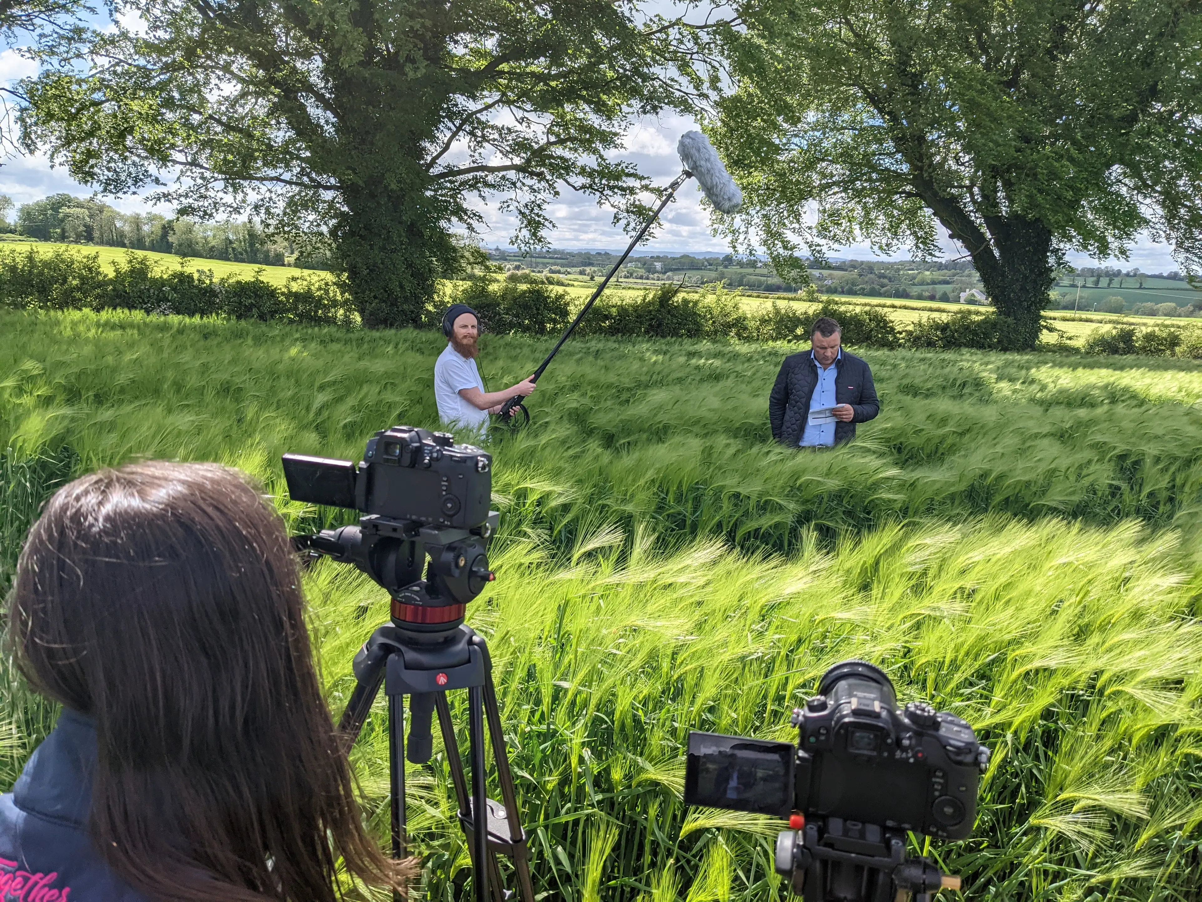 Together Digital Video Team on location in a rural green field setting